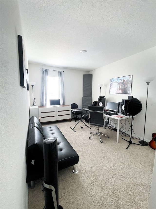 carpeted home office with a textured ceiling