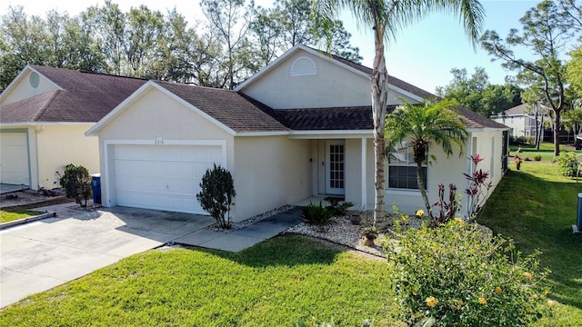 view of front of home with stucco siding, an attached garage, driveway, and a front lawn