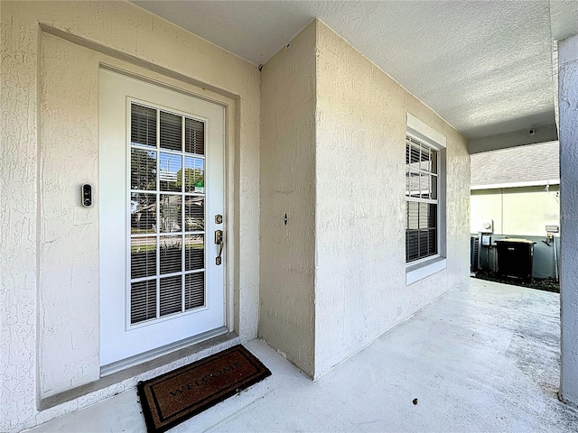 property entrance featuring covered porch