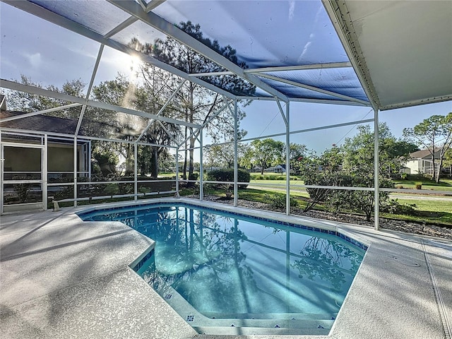 outdoor pool featuring a lanai and a patio area