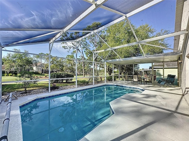 outdoor pool with a lanai and a patio