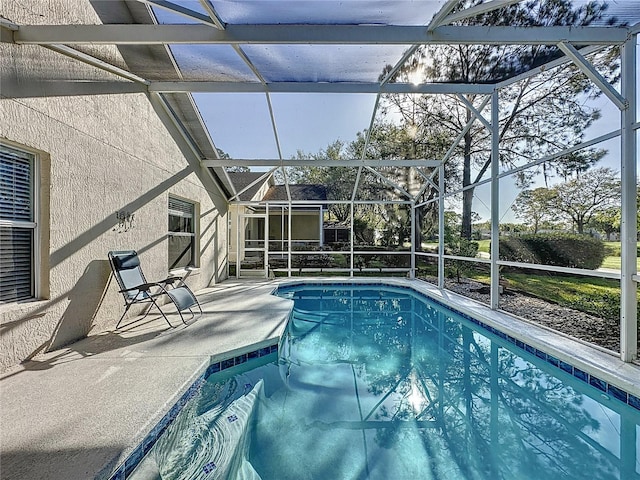 outdoor pool featuring a patio and a lanai