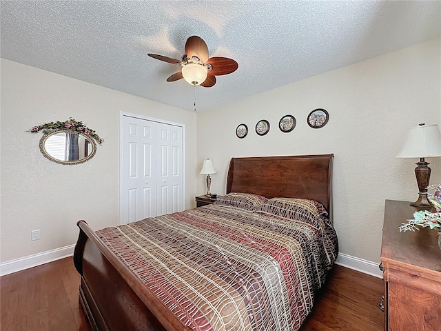 bedroom with baseboards, a textured ceiling, and wood finished floors