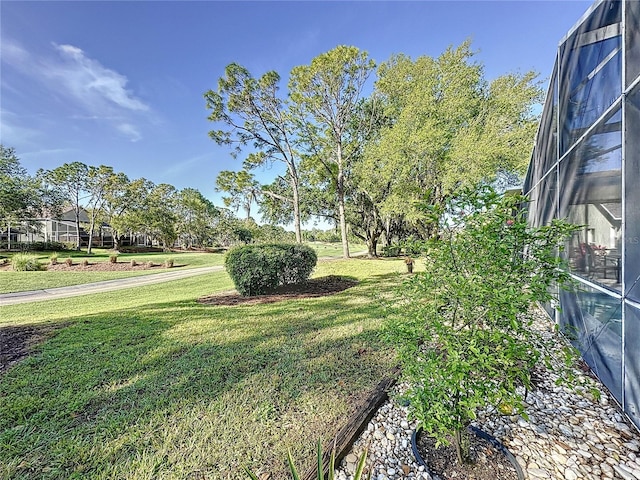 view of yard featuring a lanai