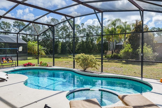 view of pool featuring a lanai, a patio area, a pool with connected hot tub, and a yard