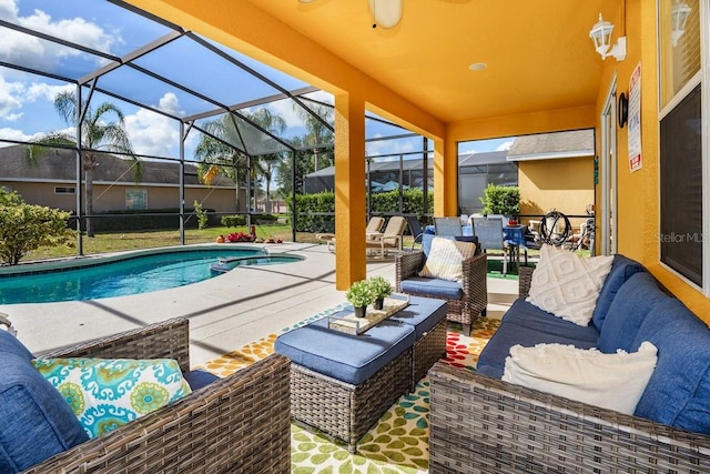 exterior space with an outdoor pool, glass enclosure, and outdoor lounge area