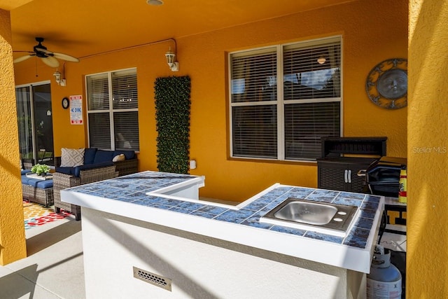 view of patio with a ceiling fan and an outdoor hangout area