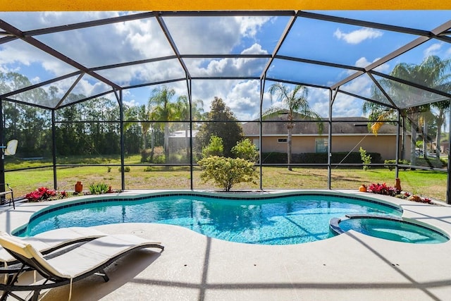 view of pool featuring a lanai, a patio area, and a pool with connected hot tub