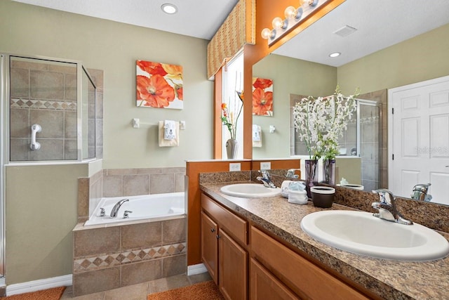 full bath featuring double vanity, a bath, a stall shower, and a sink