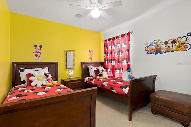 carpeted bedroom featuring a ceiling fan