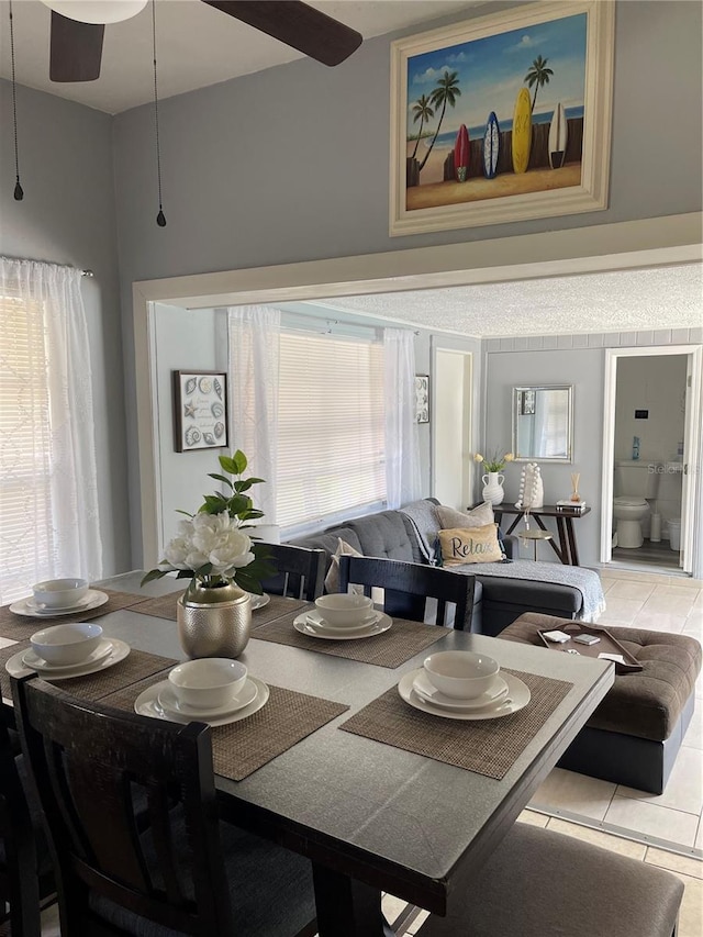 tiled dining area featuring a ceiling fan