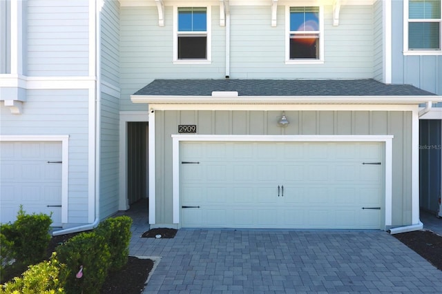 garage featuring decorative driveway