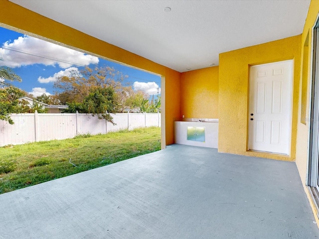 view of patio / terrace with exterior kitchen and a fenced backyard