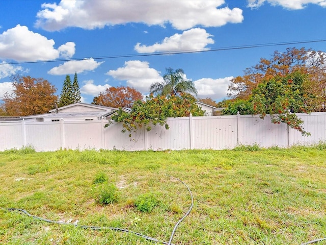 view of yard with a fenced backyard