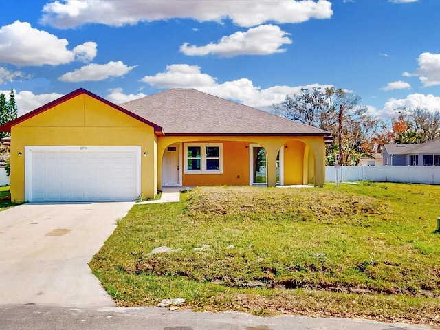 ranch-style house featuring stucco siding, fence, concrete driveway, a front yard, and a garage