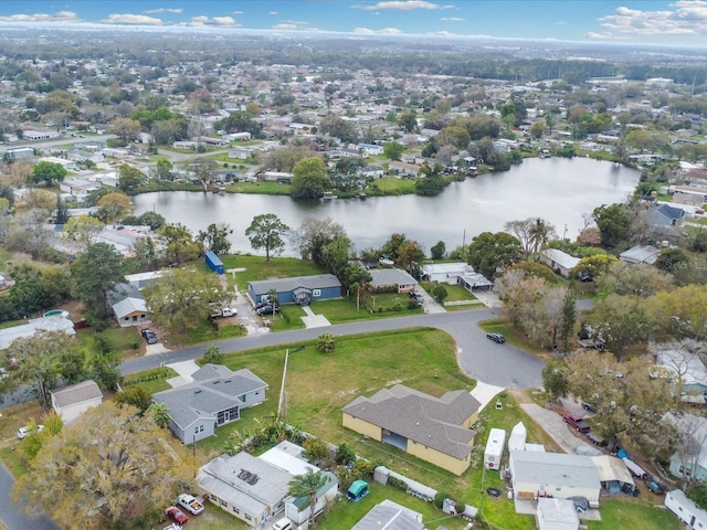 drone / aerial view featuring a residential view and a water view