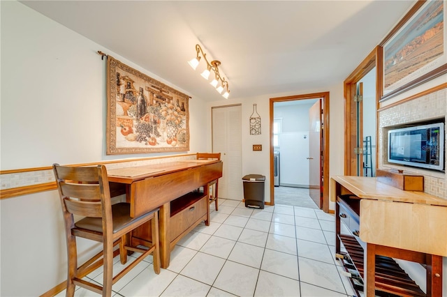 dining area with light tile patterned flooring