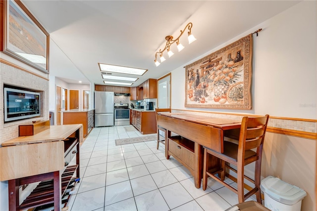 dining space with light tile patterned floors