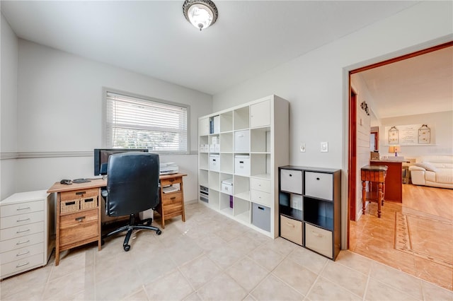 home office featuring light tile patterned flooring