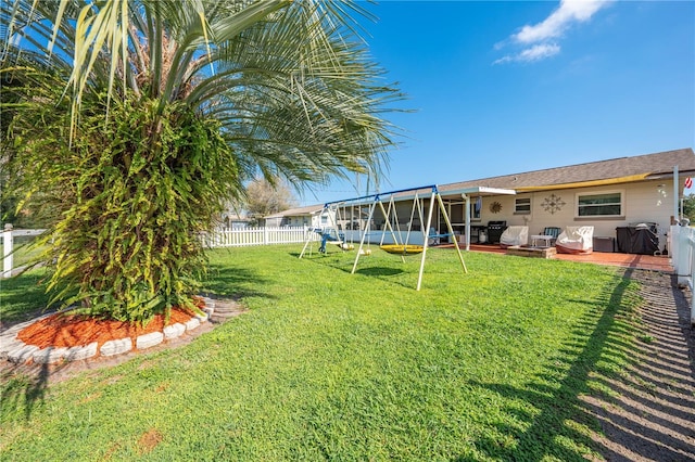 view of yard with a fenced backyard and a sunroom