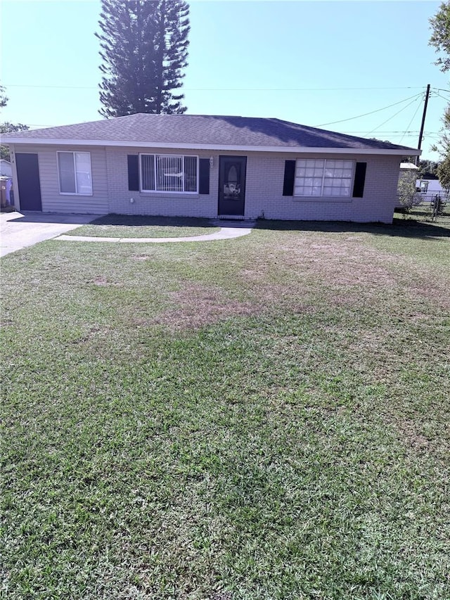 ranch-style house with a front lawn