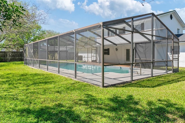 view of swimming pool featuring a patio area, a lawn, glass enclosure, and fence