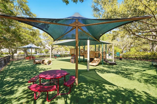 view of yard with playground community and fence