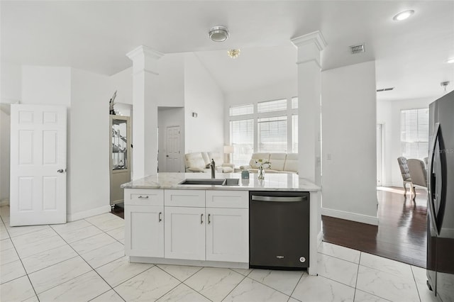 kitchen featuring dishwashing machine, freestanding refrigerator, marble finish floor, ornate columns, and a sink