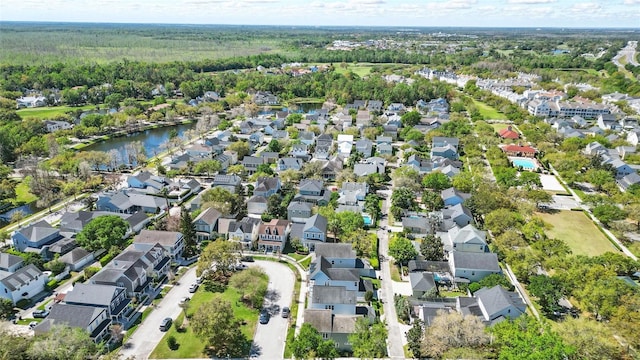 drone / aerial view with a residential view and a water view