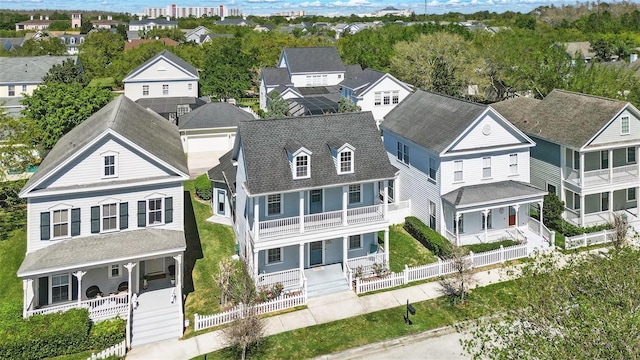 birds eye view of property with a residential view