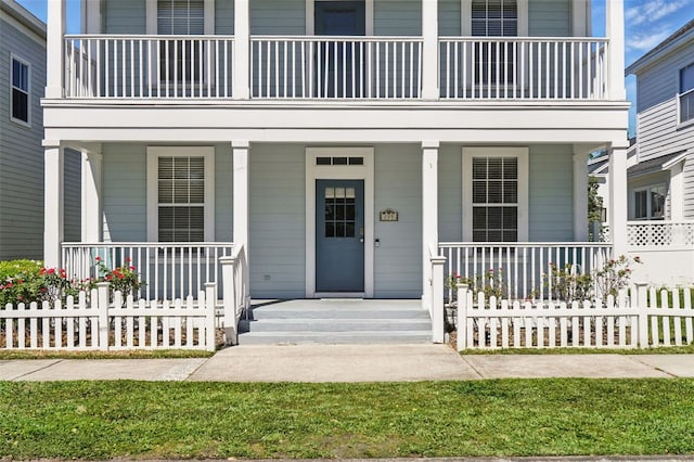 view of exterior entry with covered porch