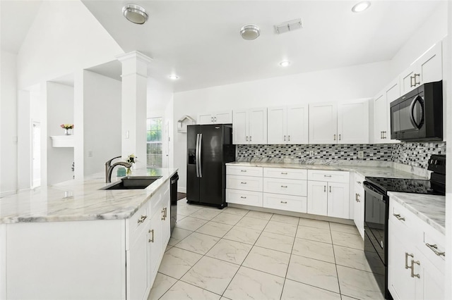 kitchen featuring visible vents, marble finish floor, black appliances, a sink, and light stone countertops