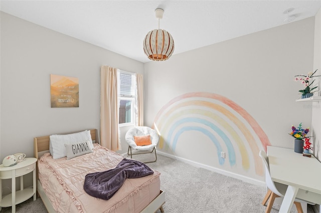 bedroom featuring baseboards and carpet