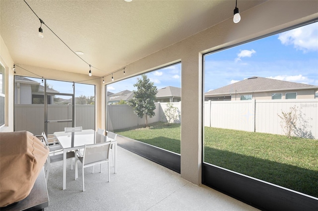 sunroom with track lighting