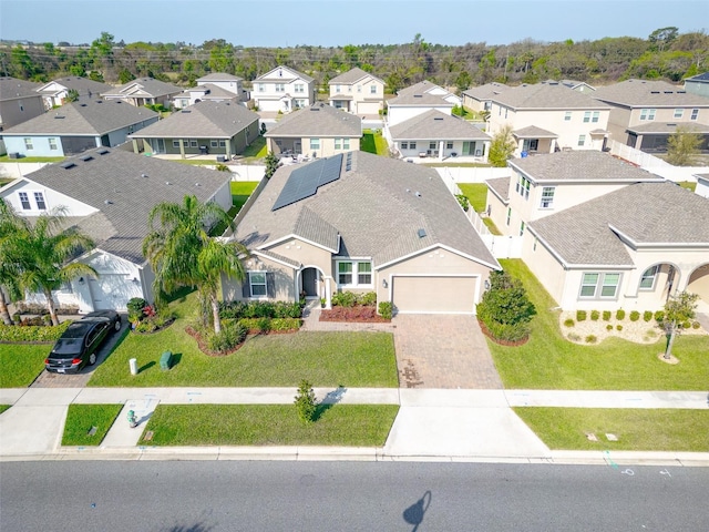 birds eye view of property with a residential view