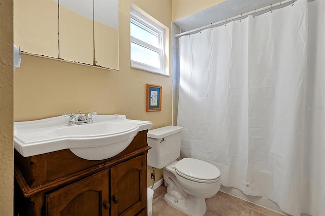 bathroom featuring vanity, tile patterned floors, curtained shower, and toilet