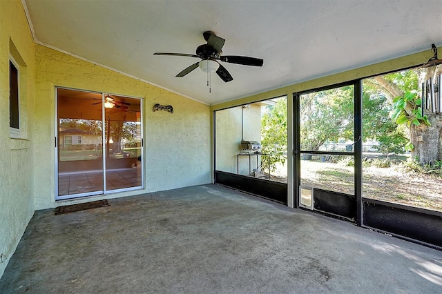 unfurnished sunroom featuring ceiling fan and lofted ceiling