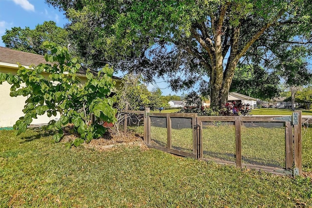 view of yard featuring a gate and fence