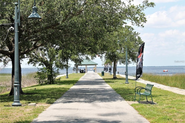 view of home's community featuring a gazebo, a lawn, and a garage