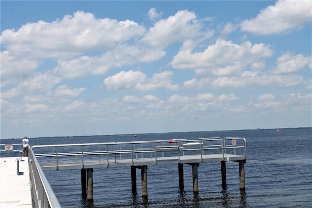 view of dock featuring a pier and a water view