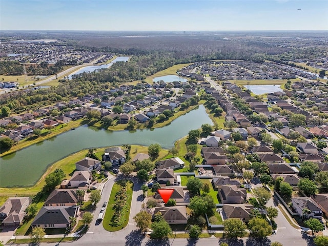 bird's eye view with a residential view and a water view