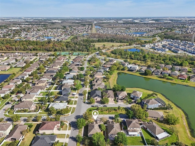 bird's eye view with a residential view and a water view