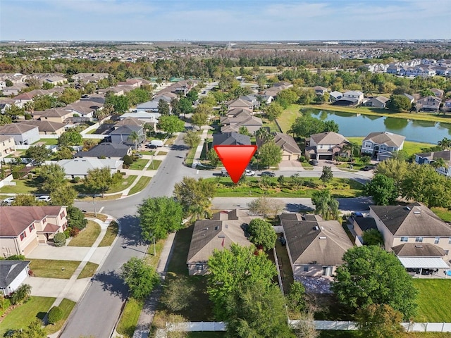 birds eye view of property featuring a residential view and a water view