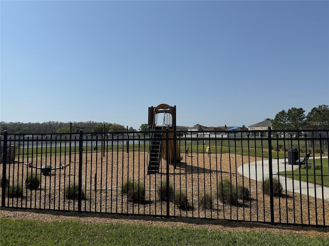 view of yard with fence and playground community