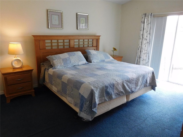 bedroom featuring carpet flooring and multiple windows