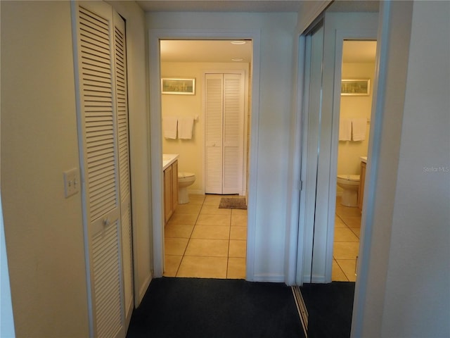 corridor featuring light tile patterned flooring