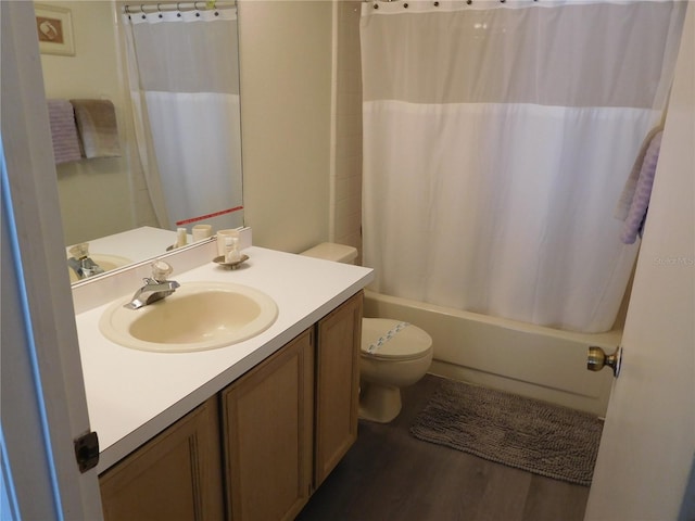 full bath with vanity, wood finished floors, toilet, and shower / bathtub combination with curtain