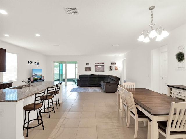 dining room featuring a notable chandelier, recessed lighting, visible vents, and light tile patterned floors