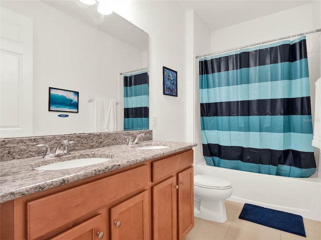 full bathroom featuring tile patterned floors, double vanity, shower / bath combo, and a sink