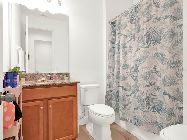 full bathroom featuring tile patterned floors, toilet, and vanity